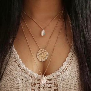 Cowry shell and hammered disc necklace trio